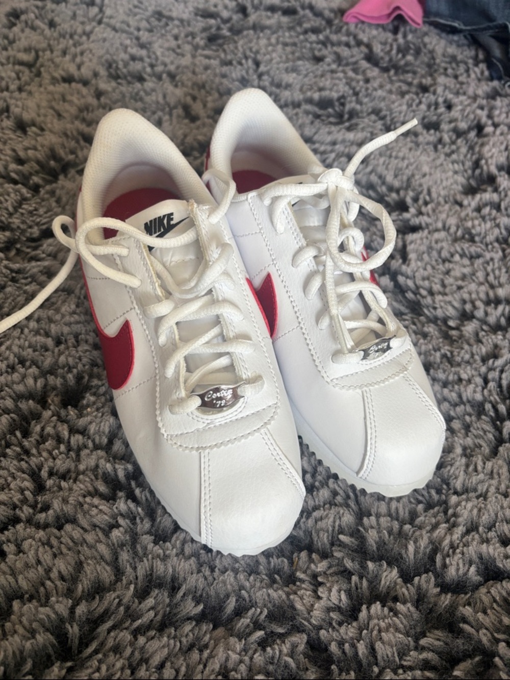 Nike White Leather Sneakers with Pink Swoosh Accent